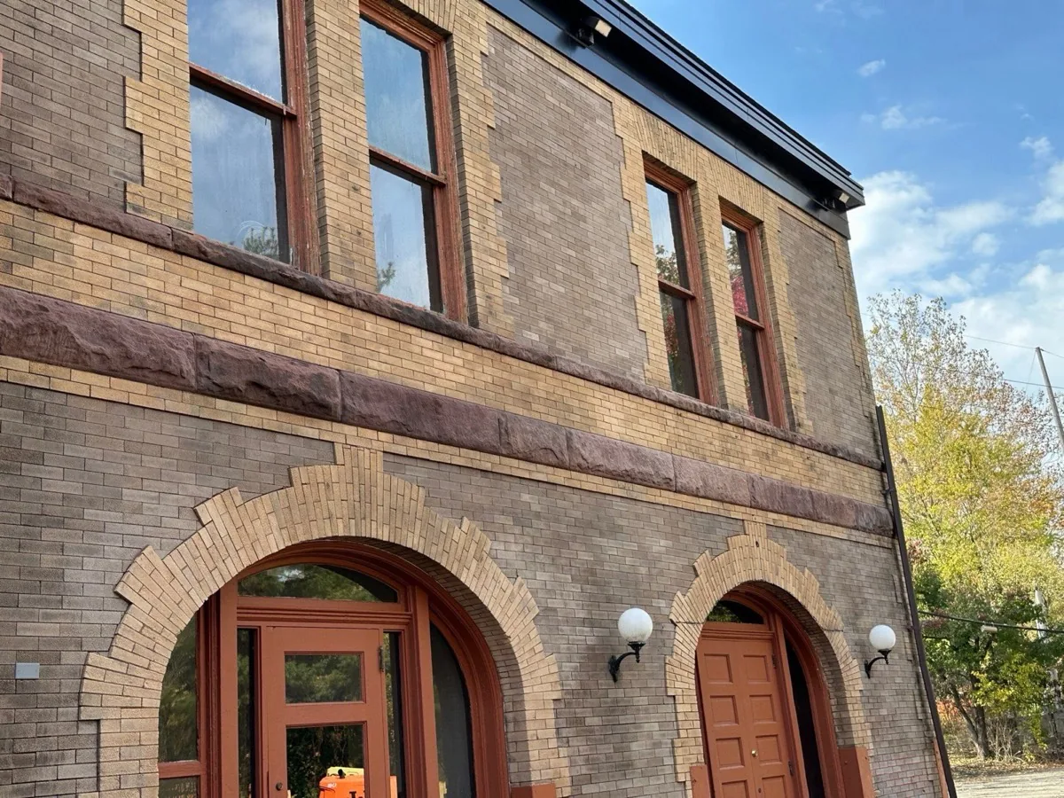Tan brick historic depot with brownstone trim